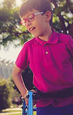 Young boy with walking assistance